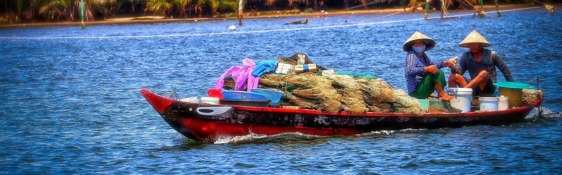 Vibrant Chau Doc floating village in Mekong Delta on a scenic Chau Doc Travel banner by Legend Travel Group.