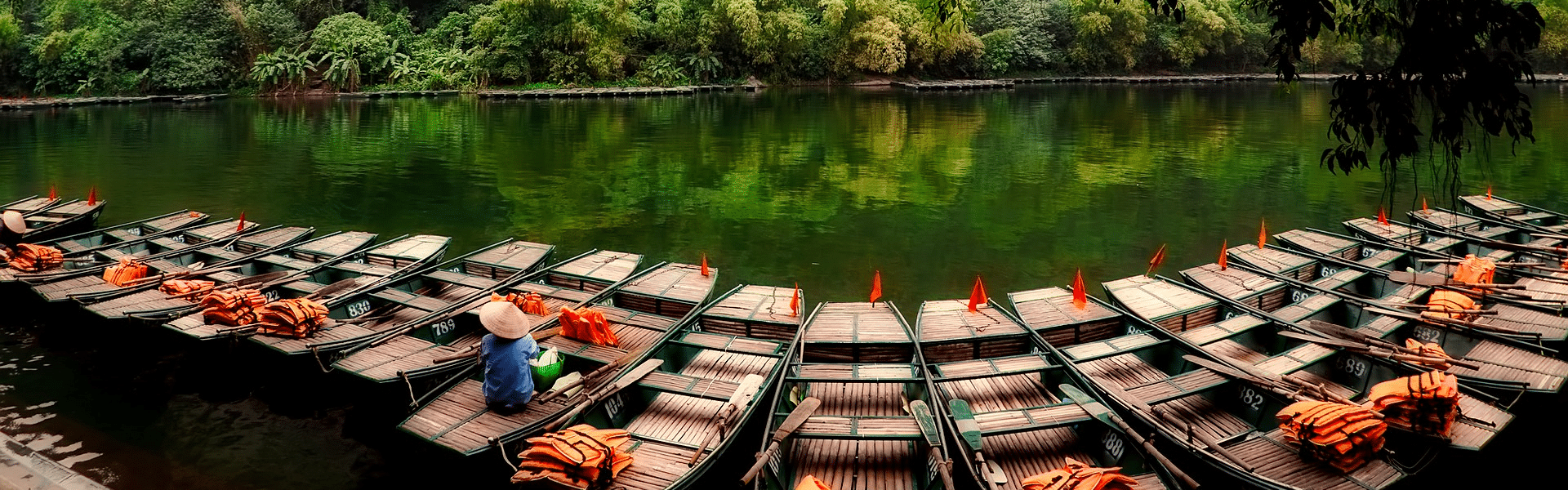 Vietnam’s tranquil coastal scenery on a Vietnam Travel banner by Legend Travel Group.