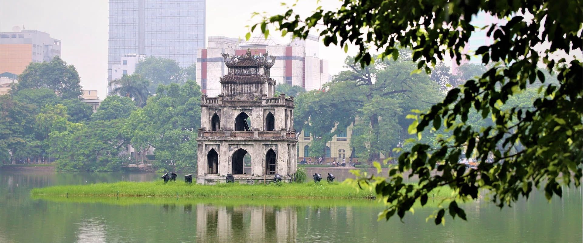 Historic Hanoi Old Quarter in Vietnam on a scenic Hanoi Travel banner by Legend Travel Group.