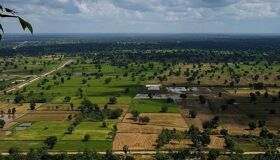 Tranquil Battambang cityscape at dusk for a Battambang Tours banner by Legend Travel Group.