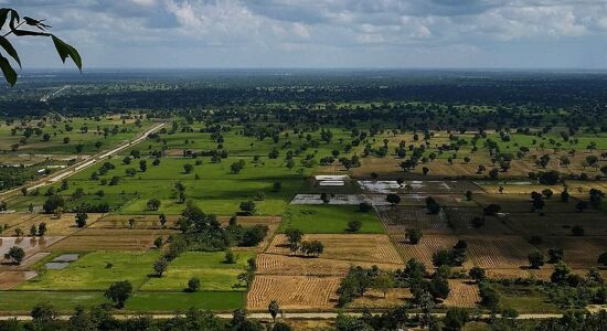 Tranquil Battambang cityscape at dusk for a Battambang Tours banner by Legend Travel Group.
