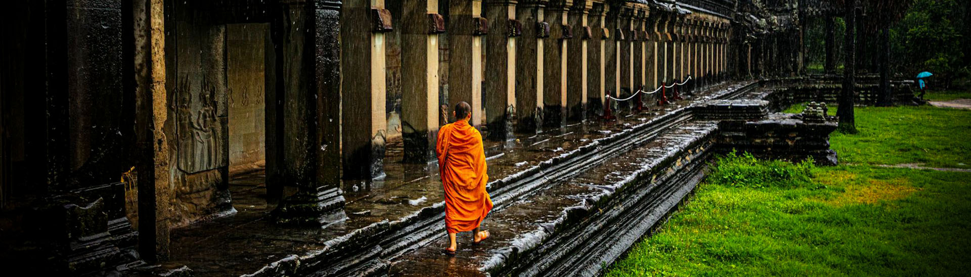 Buddhist Monk walking at Angkor Temples, Siem Reap