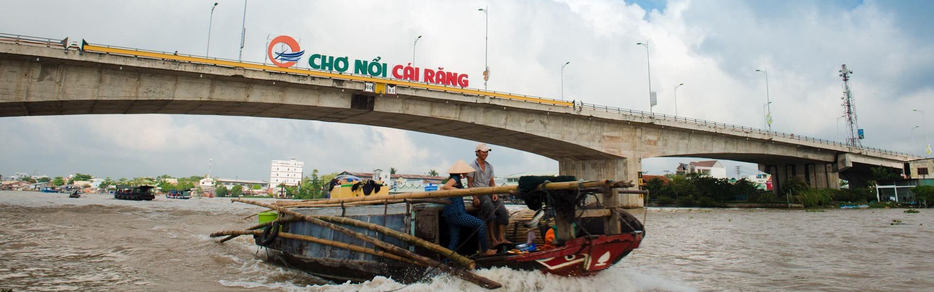 Can Tho’s lush Mekong landscape at sunset on a Can Tho Travel banner by Legend Travel Group.