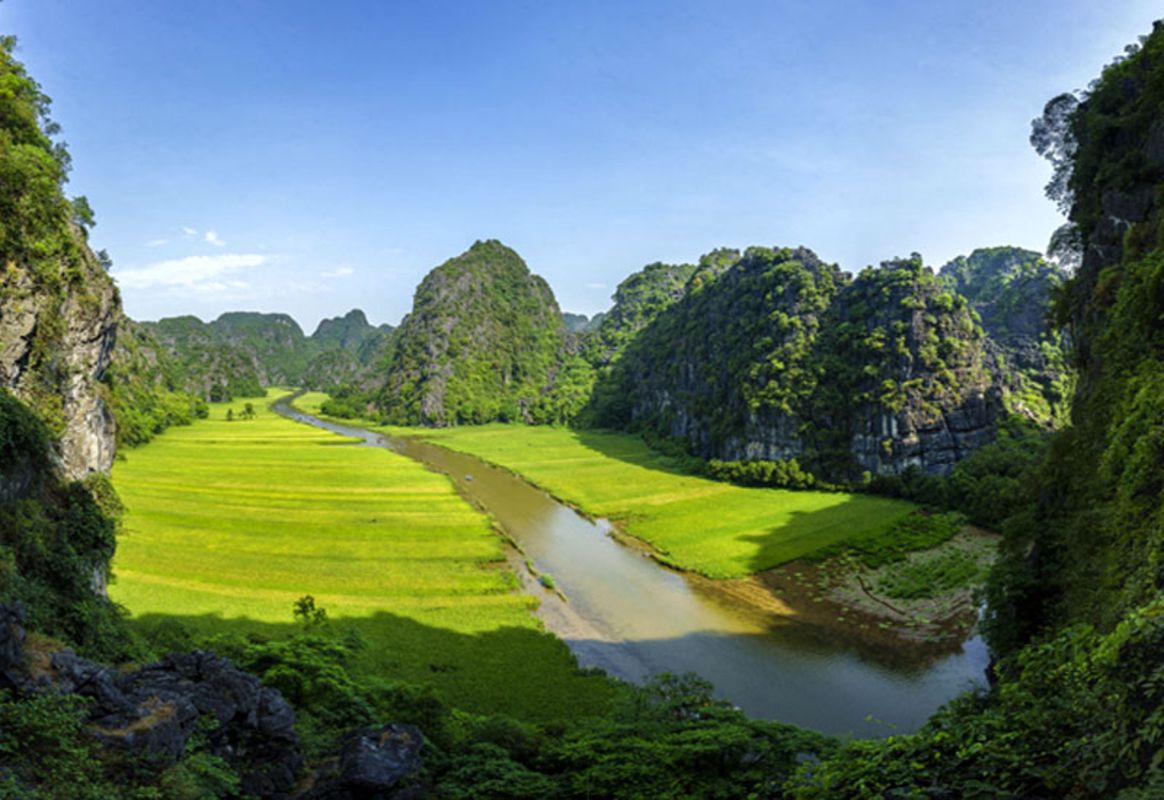 A day trip to Tam Coc cave or Trang An Grottoes in Ninh Binh