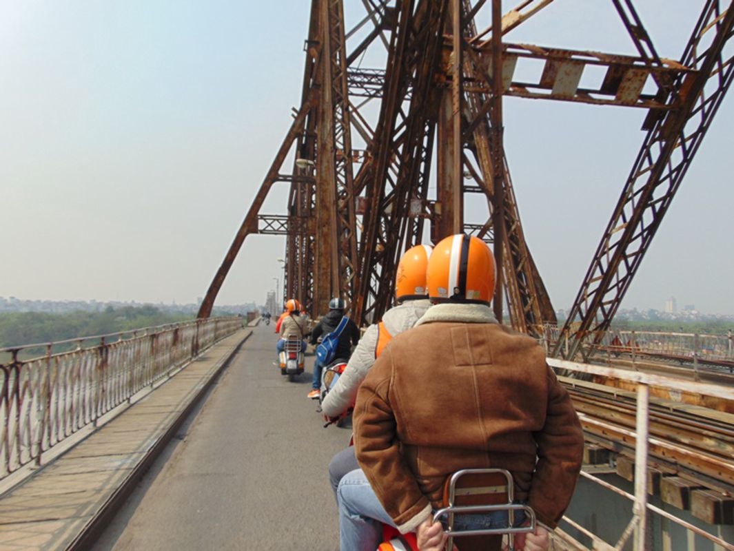 Explore local snacks near Long Bien Bridge