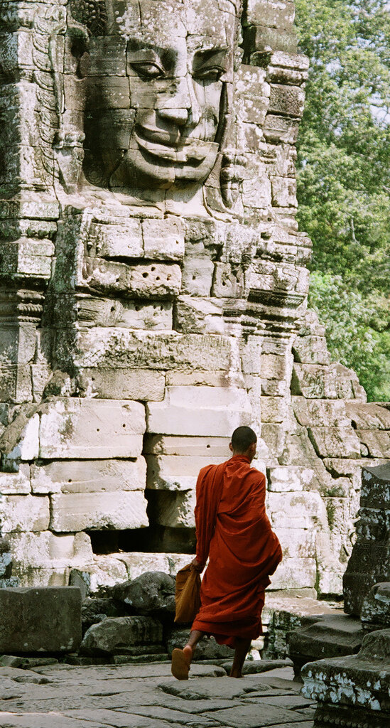 Buddhist Monk walking at the Angkor Thom Temples, Cambodia