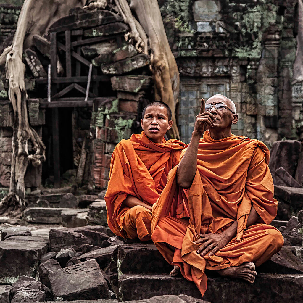 Buddhist Monks sitting at the Angkor Temples, Siem Reap