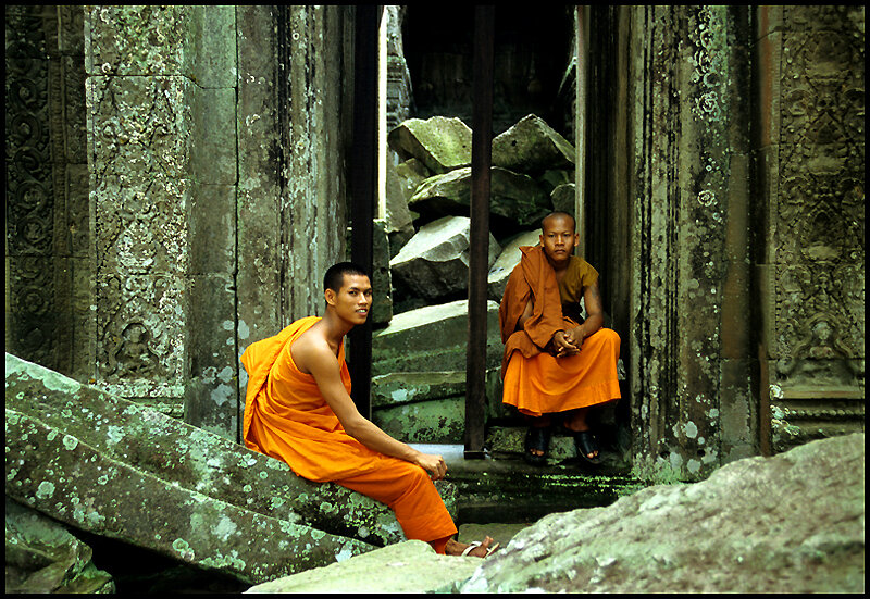 Buddhist Monks sitting at Angkor Temples, Cambodia