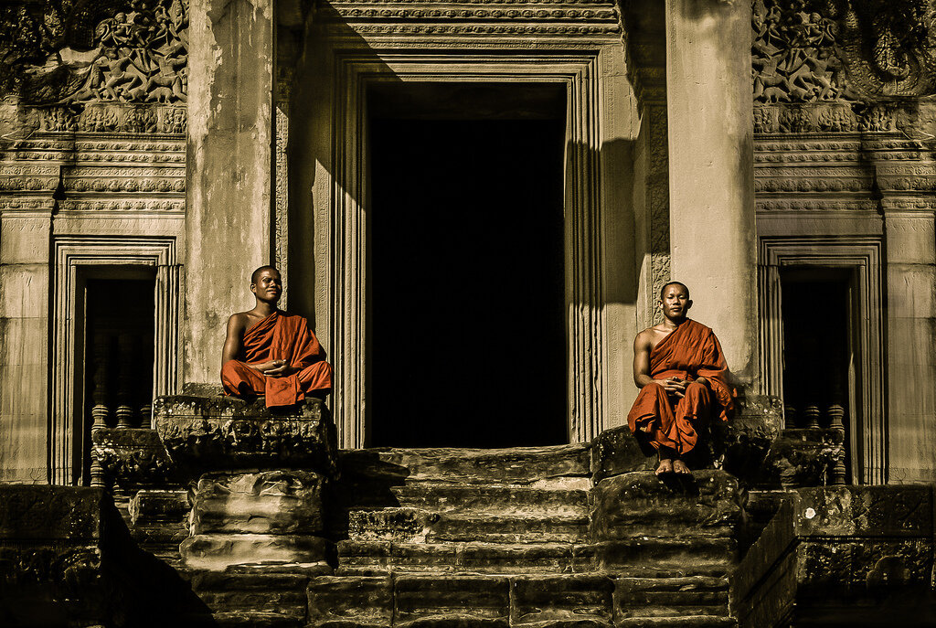 Buddhist Monks sitting at Angkor Temples, Siem Reap