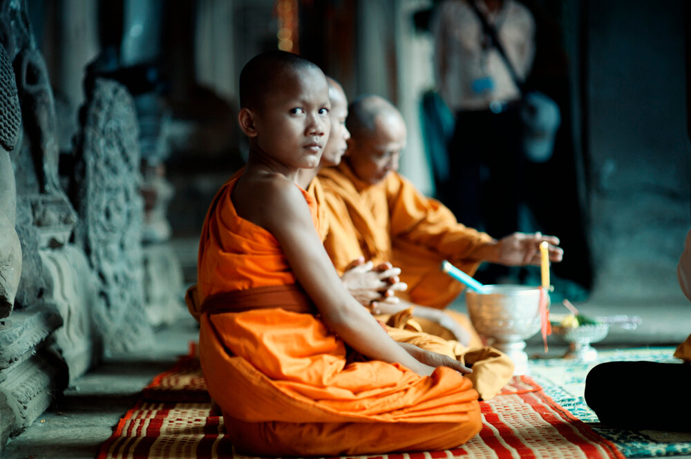 Buddhist Monks sitting at the Angkor Wat Temples, Cambodia
