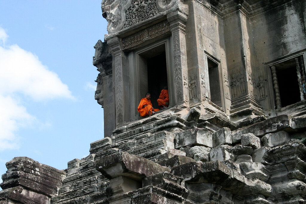 Buddhist Monks sitting at the door of the Temples in Siem Reap