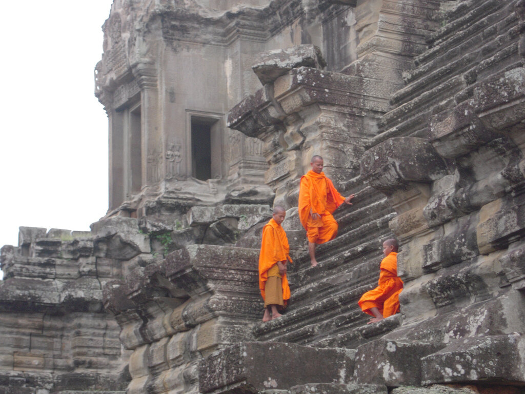 Buddhist Monks sitting at Angkor Temples, Siem Reap