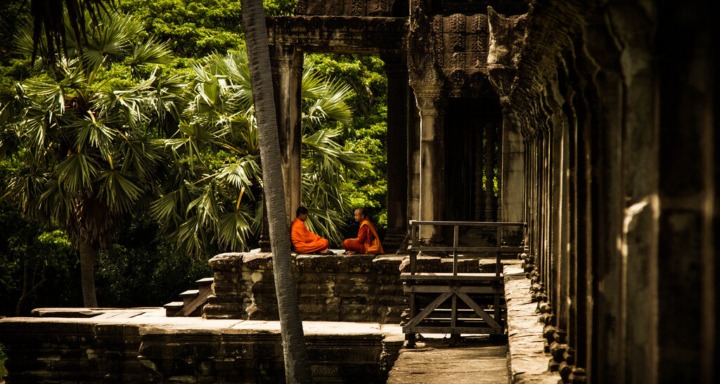 Buddhist Monks sitting at the Angkor Temples, Siem Reap
