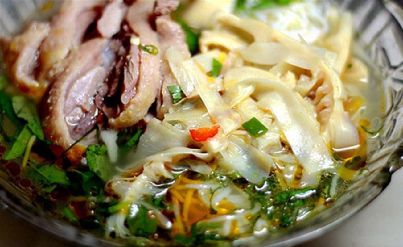 Chicken with pickled bamboo shoot - "Gà nấu măng chua." - Photograph the vibrant allure of Hoa Binh’s cuisine
